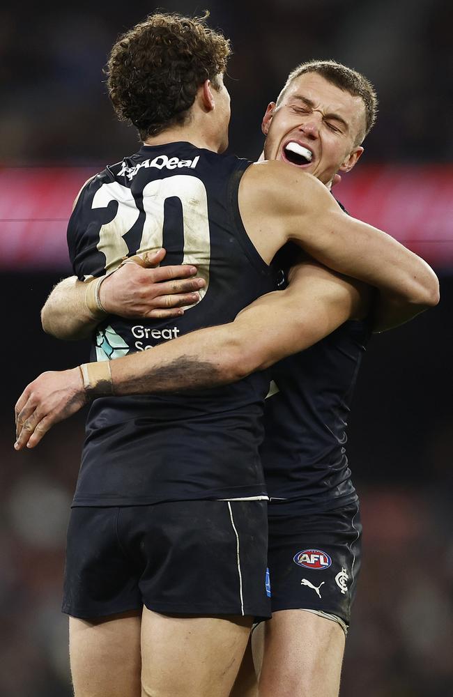 Charlie Curnow with skipper Patrick Cripps. Picture: Daniel Pockett/Getty Images