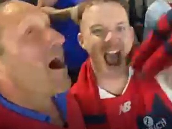 Burbank and his friend Mark Babbage celebrating Melbourne’s premiership.