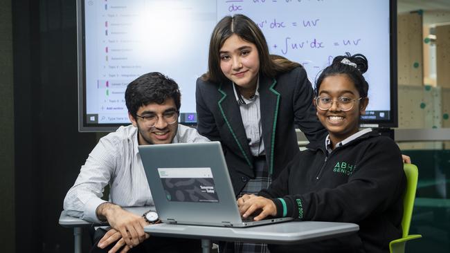 Adelaide Botanic High School year 12 students Gautam Das, Ann Razavifard and Kriti Kalyanasundaram in their maths class. Picture Mark Brake