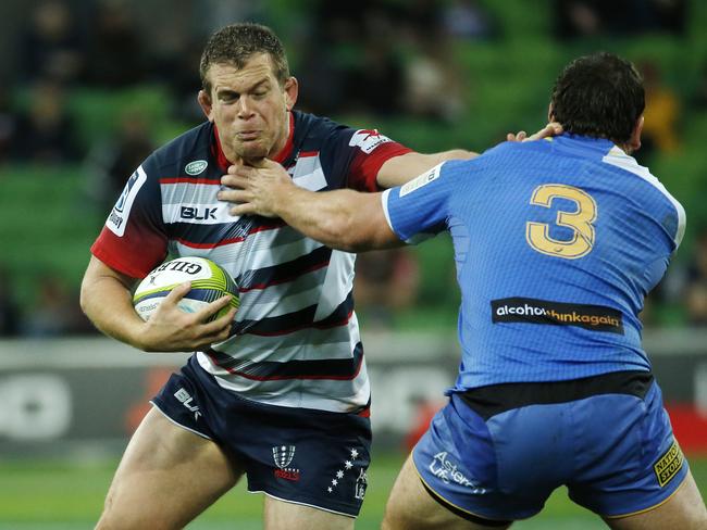 Super Rugby - Melbourne Rebels V Western Force at AAMI Park, Toby Smith palms off Guy Millar. 29th May 2016. Picture: Colleen Petch.