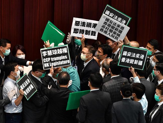 Hong Kong pro-democracy politicians holding up placards against China's security bill. Picture: AFP