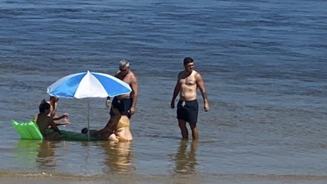 Gold Coast’s million dollar man Ash Taylor having a dip at Caloundra on the Sunshine Coast.