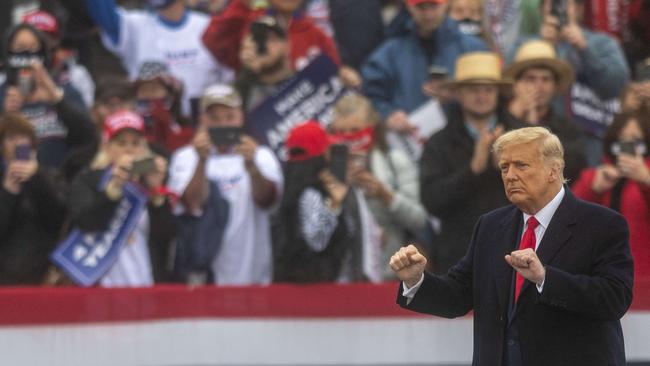 Donald Trump getting his groove on to Y.M.C.A. at a rally. Picture: AFP.