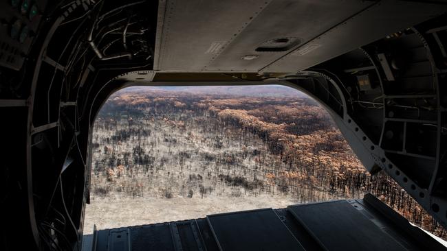 The view for the rear of an Australian Army CH-47 Chinook as it comes in to land at the Mallacoota airport, Victoria. *** Local Caption *** Operation BUSHFIRE ASSIST 19-20 is the Australian Defence Forceâ€™s (ADF) support to the national bushfire emergency. Around 5,400 ADF personnel are currently supporting Operation BUSHFIRE ASSIST, including approximately 1,400 Reservists The ADF is providing air and ground transport, route clearance, logistics, engineering, aviation support and accommodation support to the firefighting and recovery effort. The ADF established three Joint Task Forces under BUSHFIRE ASSIST 19-20 to facilitate ADF support to emergency services in New South Wales, Victoria, South Australia and Tasmania. The ADF is working alongside government agencies to coordinate the support, and ensure Defence assets are deployed to communities where they are needed. International partners have also contributed to the response effort with personnel from Papua New Guinea, Fiji, Indonesia, New Zealand, Singapore and Japan operating alongside their Australian counterparts to assist during this emergency.