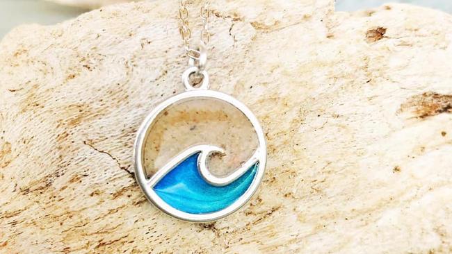 Under the Noosa Collective design label, Cathie Withyman has a range of earrings, necklaces and bracelets, using sand from beaches, to turn memories into physical keepsakes.