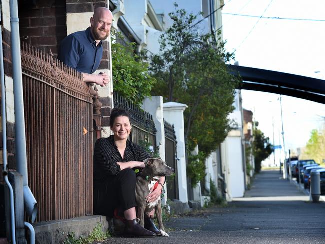 Andy Gibson and wife Sarah Kenny with their dog Lulu in Carlton North. Picture: Tony Gough