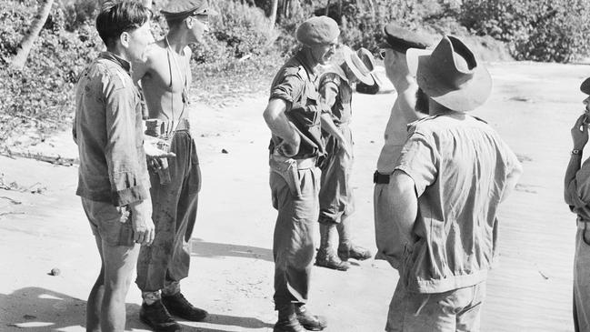 Captain Jock McLaren (centre) in October 1945 on Berhala Island at Sandakan, from where he had earlier eascaped a POW camp. Picture: Australian War Memorial.