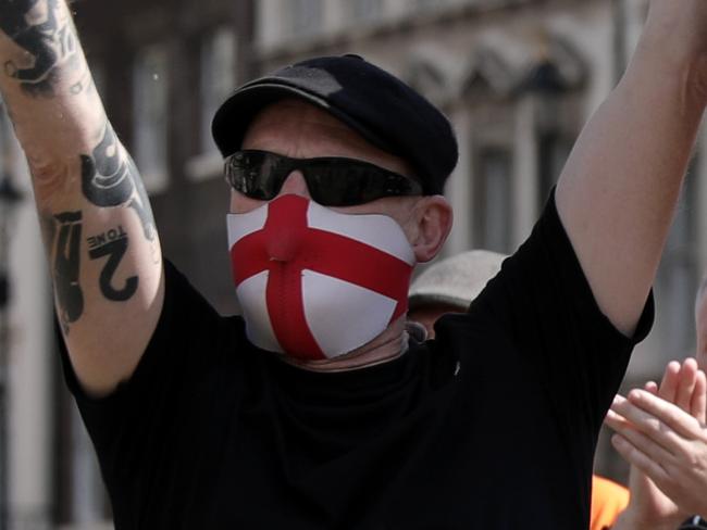 LONDON, UNITED KINGDOM  - JUNE 13: A group gathers around the Winston Churchill statue on Parliament Square on June 13, 2020 in London, United Kingdom. Following a social media post by the far-right activist known as Tommy Robinson, members of far-right linked groups have gathered around statues in London. Several statues in the UK have been targeted by Black Lives Matter protesters for their links to racism and the slave trade. (Photo by Dan Kitwood/Getty Images)