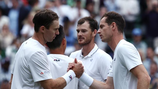 Rinky Hijikata and John Peers of Australia shake hands with Andy Murray and Jamie Murray. Picture: Francois Nel/Getty Images