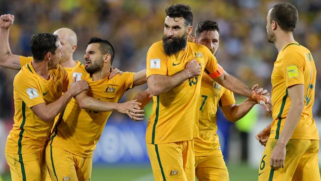 Mile Jedinak celebrates his second penalty against Honduras.