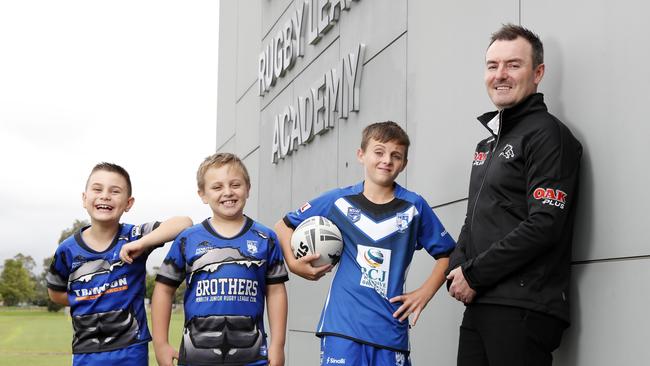 Penrith District Junior League GM Nathan Mairleitner with players Braxton Mairleitner, 8, Lucas Breust, 7, and his brother Riley Breust, 12, from Penrith Brothers. Picture: Jonathan Ng