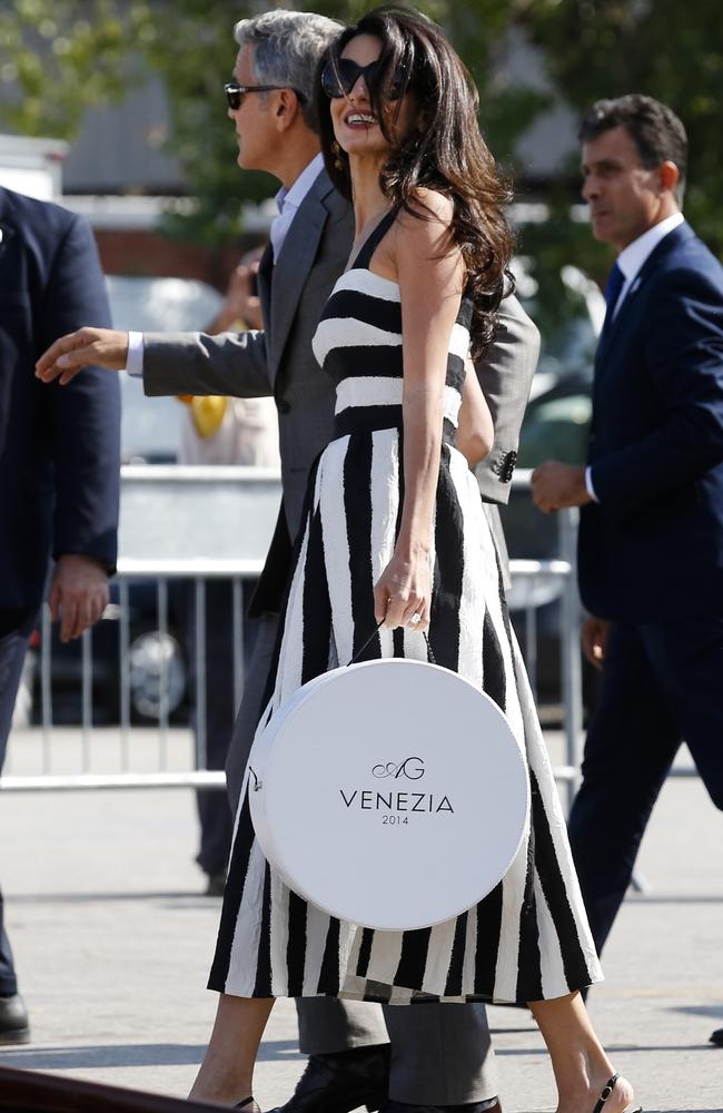 George Clooney, left, and Amal Alamuddin arrive in Venice, Italy (AP Photo/Luca Bruno)