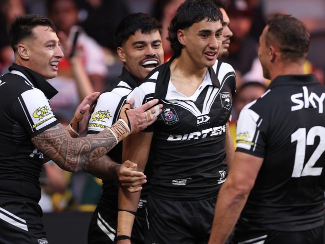 SYDNEY, AUSTRALIA - NOVEMBER 10:  Casey McLean of New Zealand celebrates with team mates after scoring a try during the 2024 Pacific Championships Pacific Bowl Men's match between the New Zealand Kiwis and PNG Kumuls at CommBank Stadium on November 10, 2024 in Sydney, Australia. (Photo by Matt King/Getty Images)