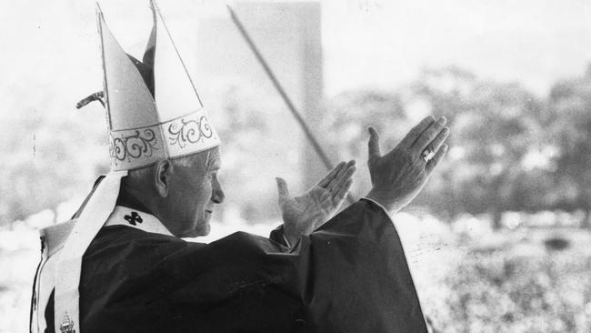 Pope John Paul II gestures from the podium at the papal mass, Victoria Park Racecourse, Adelaide, 30 Nov 1986.