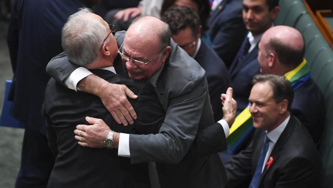 Liberal MP Warren Entsch hugs Australian Prime Minister Malcolm Turnbull after the passing of the Marriage Amendment Bill in the House of Representatives at Parliament House in Canberra, Thursday, December 7, 2017. Picture: AAP /Lukas Coch.