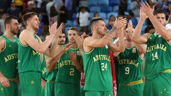 Boomers players celebrate their win over the Philippines on Thursday night.