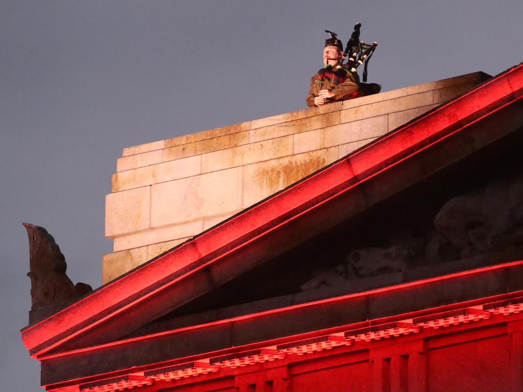 A bagpiper plays at the dawn service at the Shrine of Remembrance. Picture: David Crosling