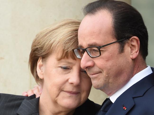 Unity ... President Hollande welcomes German Chancellor Angela Merkel. Picture: AFP