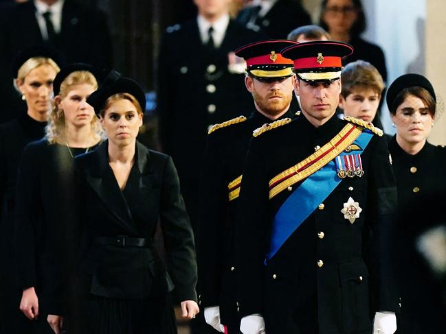 Queen Elizabeth II 's grandchildren (L-R) Zara Tindall, Britain's Lady Louise Windsor, Britain's Princess Beatrice of York, Britain's Prince Harry, Duke of Sussex,, Britain's Prince William, Prince of Wales, James, Viscount Severn and Britain's Princess Eugenie of York arrive to hold a vigil at the coffin of Queen Elizabeth II, lying in state on the catafalque in Westminster Hall, at the Palace of Westminster in London on September 17, 2022, ahead of her funeral on Monday. - Queen Elizabeth II will lie in state in Westminster Hall inside the Palace of Westminster, until 0530 GMT on September 19, a few hours before her funeral, with huge queues expected to file past her coffin to pay their respects. (Photo by Aaron Chown / POOL / AFP)