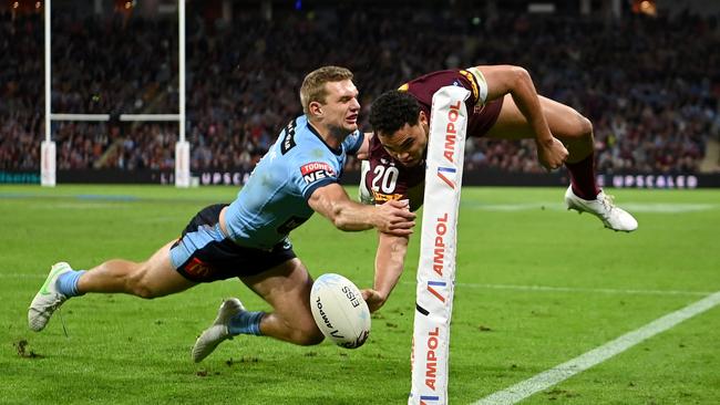 Blues centre Tom Trbojevic pulls off a try-saving tackle on Maroons winger Xavier Coates Picture: NRL Images