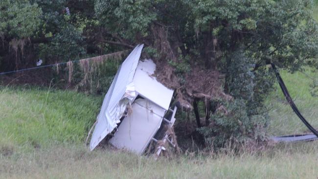 A shed is left in the middle of a field after being destroyed by flash flooding. Corindi was hit by an intense storm on Thursday February 25, which caused significant flash flooding which was described as being extremely fast moving and likened to a tsunami. Photo: Tim Jarrett