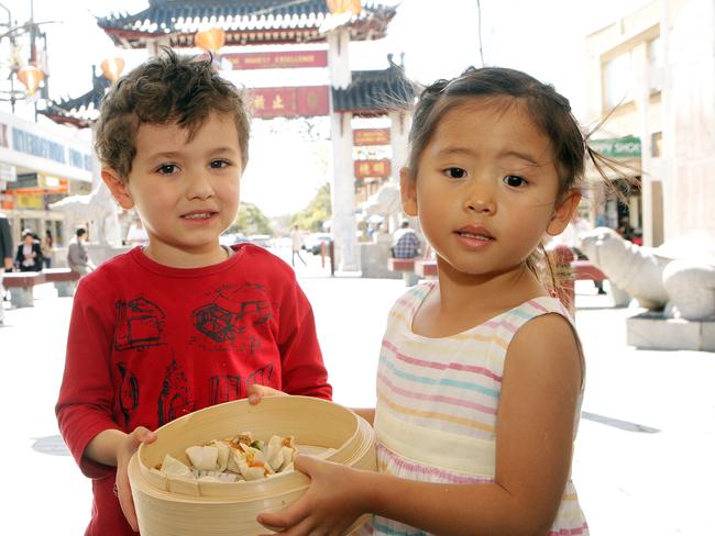 Christian De Nuntiis, 3, and Maiya Do, 3, making dumplings for Moon Festival in Cabramatta.