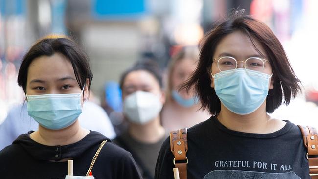 MELBOURNE, AUSTRALIA - NewsWire Photos - JANUARY 21, 2022:  Victoria has recorded a drop in new Covid cases with hospital admissions expected to peak in the coming weeks. MelbourneÃs CBD foot traffic seen to be busier than last week. People are still wearing masks outdoors. Picture: NCA NewsWire/Sarah Matray