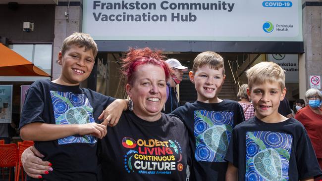 Karen Gibbs and her children at the Frankston jab hub. Picture: Aaron Francis