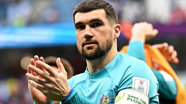 Australia's goalkeeper #01 Mathew Ryan celebrates after winning the Qatar 2022 World Cup Group D football match between Tunisia and Australia at the Al-Janoub Stadium in Al-Wakrah, south of Doha on November 26, 2022. (Photo by Anne-Christine POUJOULAT / AFP)