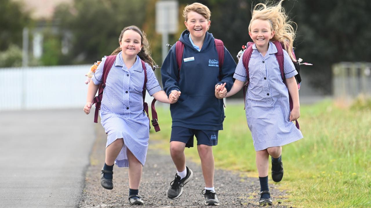 Victoria’s St Anthony’s Catholic Primary School students Lara, year 1, Austin, year 6 and Eden, year 3, were thrilled to get back to school, but it’s unlikely they and their classmates will be able to be vaccinated against Covid-19 before the end of the year. Picture: Rob Leeson