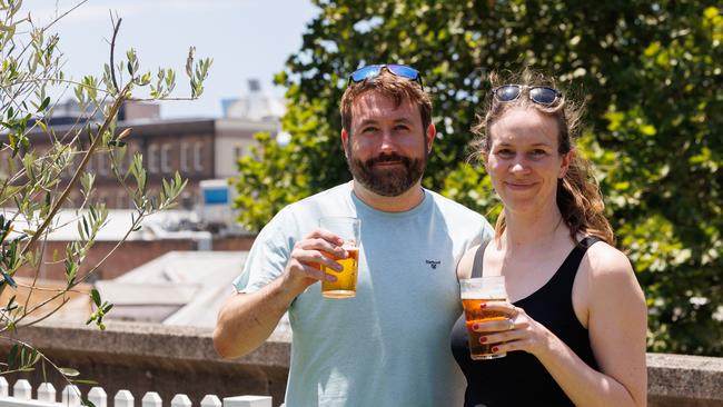 Dan Goldsworthy &amp; Katie Newlands from the UK, drinking VB at the Glenmore Hotel in Sydney.