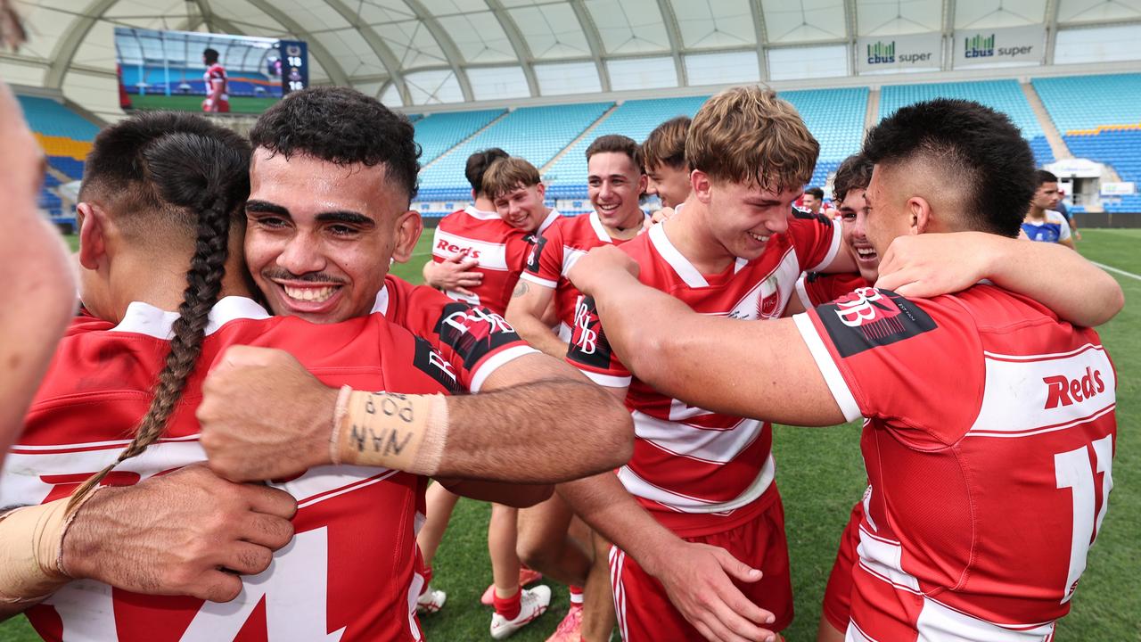 NRL National Schoolboys Cup final at CBUS Stadium between Palm Beach Currumbin and Patrician Blacktown Brothers. The Red Army and Palm Beach Currumbin players celebrate the win. .Picture Glenn Hampson