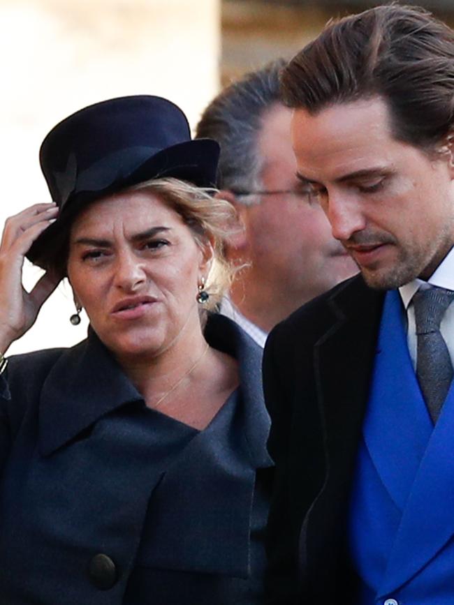 British artist Tracey Emin holds onto her hat on a windy day at Windsor Castle. Picture: AFP