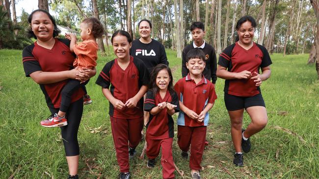 Georgina Pritchard-Malaefono with her seven children, Falala, 12, Edward, 2, Taramati, 9, Hope, 4, Richard, 6, Shane, 13, and Molly, 10, in Busby, southwest Sydney. Picture: Justin Lloyd.