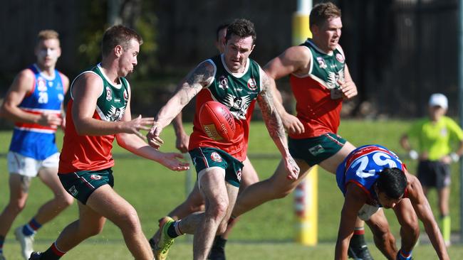 Cutters' Chris Ransom is shielded by teammate James Dixon in the AFL Cairns Premiership Men's match between the South Cairns Cutters and Centrals Trinity Beach Bulldogs, held at Fretwell Park. Picture: Brendan Radke