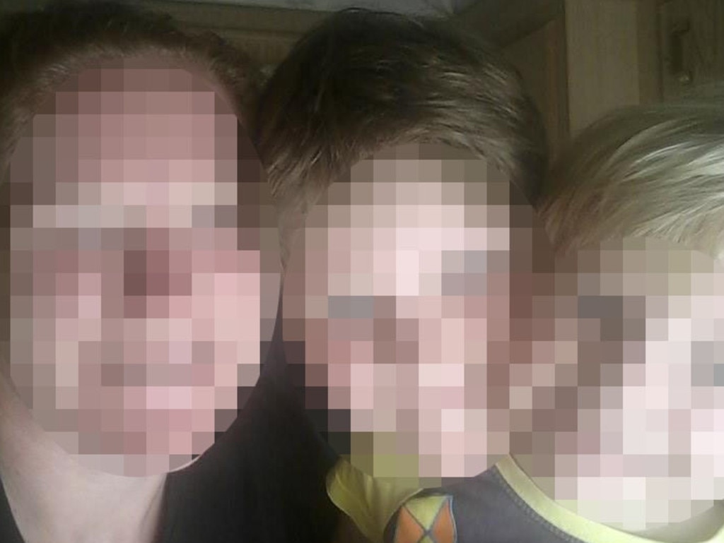 The mother charged with murder and attempted murder pictured with her two sons, aged 8 and 5, before she allegedly tried to kill one and drowned the youngest.