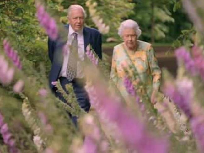 The Queen and Sir David Attenborough are filmed walking through Buckingham Palace’s immaculate gardens. Picture: ITV