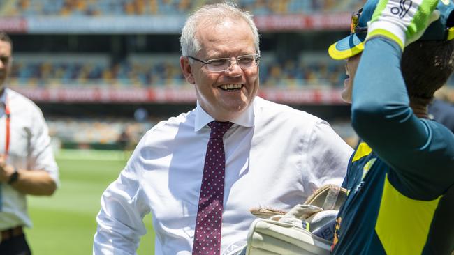 Scott Morrison meets with Tim Paine during the Australia nets session at The Gabba. Picture: Getty