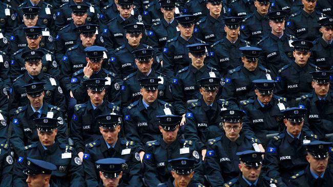 TOPSHOT - New members of Kosovo Police force attend the graduation ceremony of the 59th generation of the Kosovo Police, in Pristina, on April 18, 2024. (Photo by Armend NIMANI / AFP)