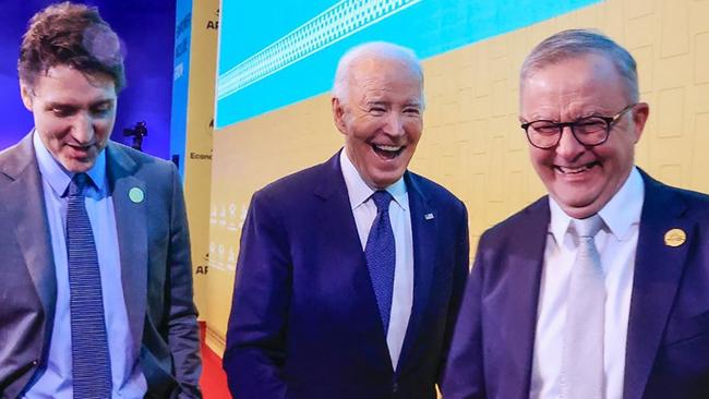 This handout picture released by the Peruvian news agency Andina shows US President Joe Biden (C), Canada's Prime Minster Justin Trudeau and Australian Prime Minister Anthony Albanese smiling during the APEC Summit at the Convention Centre in Lima, on November 15, 2024. (Photo by ANDRES VALLE / ANDINA / AFP) / RESTRICTED TO EDITORIAL USE - MANDATORY CREDIT "AFP PHOTO / ANDINA / ANDRES VALLE" - NO MARKETING - NO ADVERTISING CAMPAIGNS - DISTRIBUTED AS A SERVICE TO CLIENTS