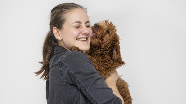 Anna Podolsky with a friendly pooch.