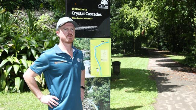 Queensland Parks and Wildlife Service regional director Matthew Brien stands by visitor information signage at Crystal Cascades. Picture: Arun Singh Mann