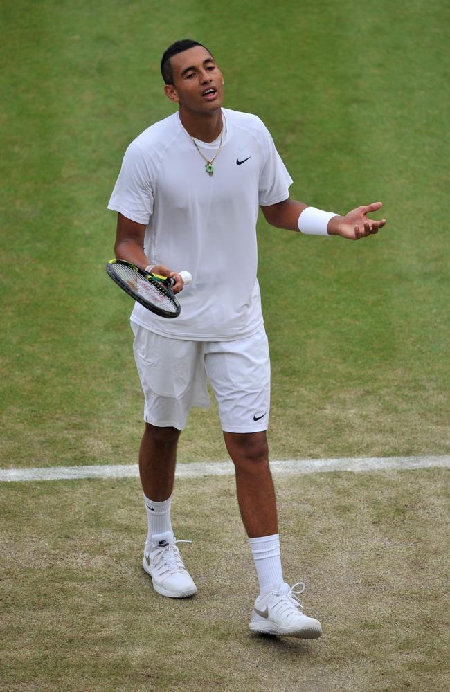 Australia's Nick Kyrgios reacts during his men's singles quarter-final match against Canada's Milos Raonic on day nine of the 2014 Wimbledon Championships at The All England Tennis Club in Wimbledon, southwest London, on July 2, 2014. Raonic won 6-7, 6-2, 6-4, 7-6. AFP PHOTO / GLYN KIRK - RESTRICTED TO EDITORIAL USE
