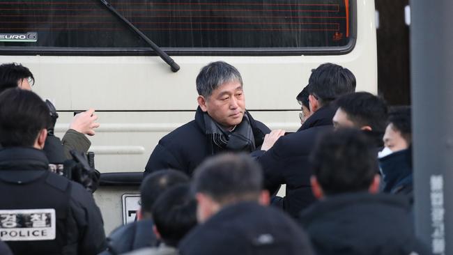 Members of the Corruption Investigation Office for High-ranking Officials gather in front of the official residence. Picture: Getty Images