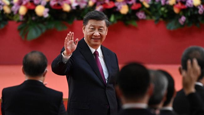 President Xi Jinping waves following his speech after a ceremony to inaugurate the city's new leader and government in Hong Kong on July 1 on the 25th anniversary of the city's handover from Britain to China. Picture: AFP