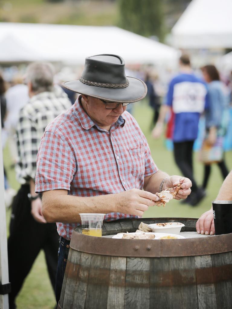 Enjoying the barbecued chicken at the Taste of the Huon festival. Picture: MATHEW FARRELL