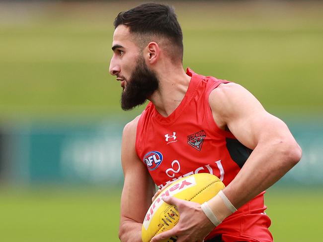 MELBOURNE, AUSTRALIA - JUNE 06: Saad El-Hawli of the Bombers runs with the ball during an Essendon Bombers AFL training session at The Hangar on June 06, 2024 in Melbourne, Australia. (Photo by Kelly Defina/Getty Images)