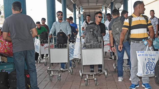 Manus Island asylum seekers seen leaving Papua New Guinea for the United States. (Pic: Supplied.)