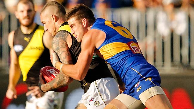 Dustin Martin is tackled by Elliot Yeo.