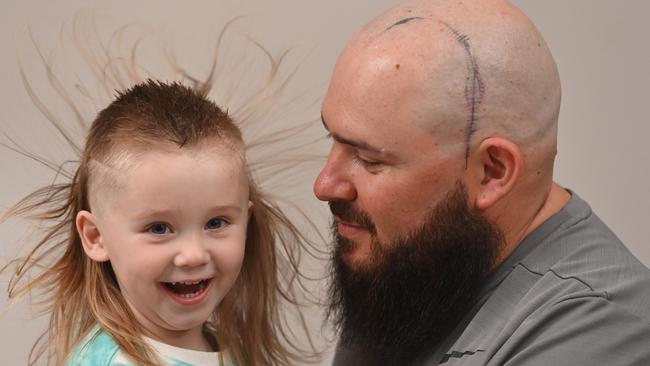 Ryker Masters, 2, will chop off his mullet to raise money for a cancer charity while dad Tim Masters will take off his beard, also to raise money. Four years ago Ryker’s big sister died from a rare brain tumour. Picture: Keryn Stevens